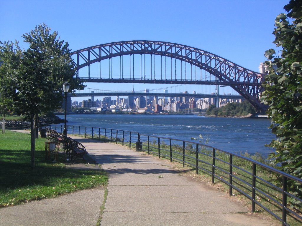Astoria Park in Queens, New York, with the Hell Gate Bridge beyond the treeline.