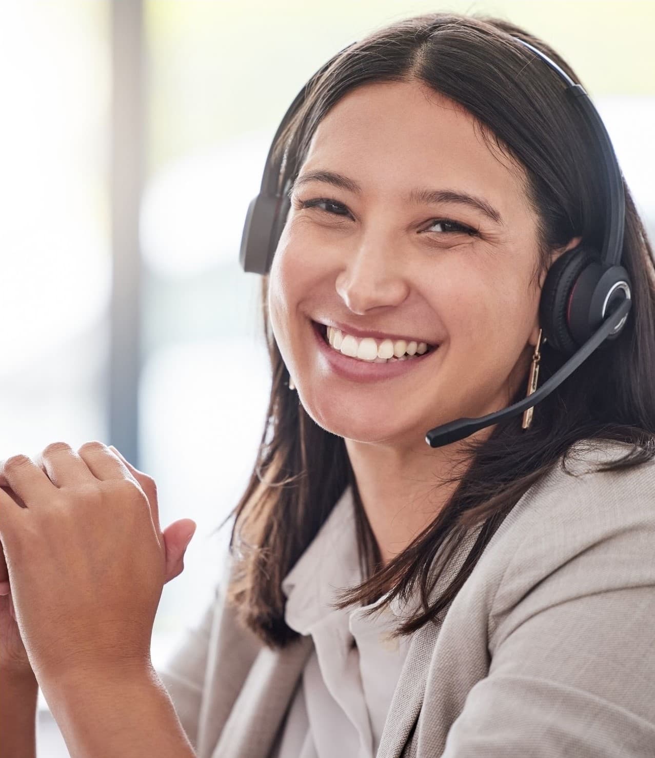 Smiling accessibility coordinator wearing a headset, on call for event day