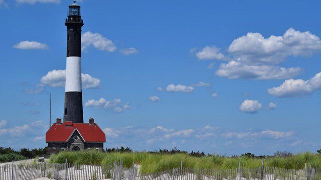 The Fire Island Lighthouse standing above the dunes on Long Island, New York.