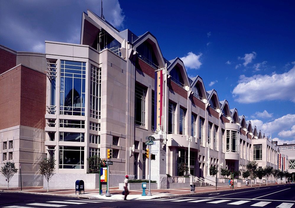 The glass frontage of the Pennsylvania Convention Center along Arch Street.
