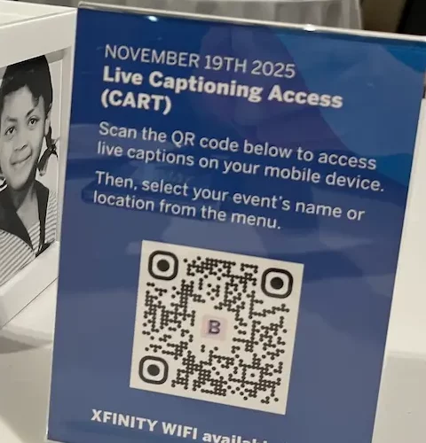 Step 1: a tabletop sign headed 'November 19th 2025, Live Captioning Access (CART)' telling attendees to scan the QR code below to access live captions on their mobile device, then select their event name or location from the menu.