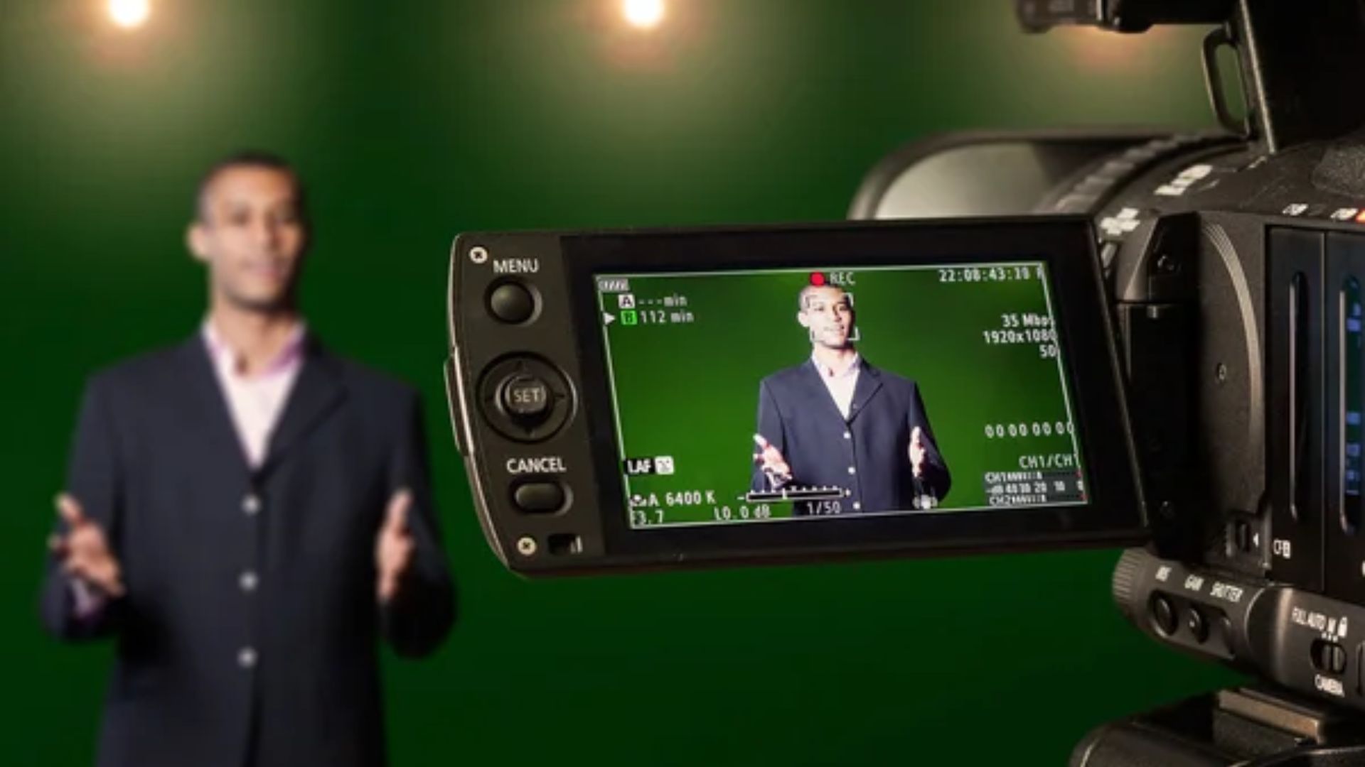 Sign language presenter recording in a studio