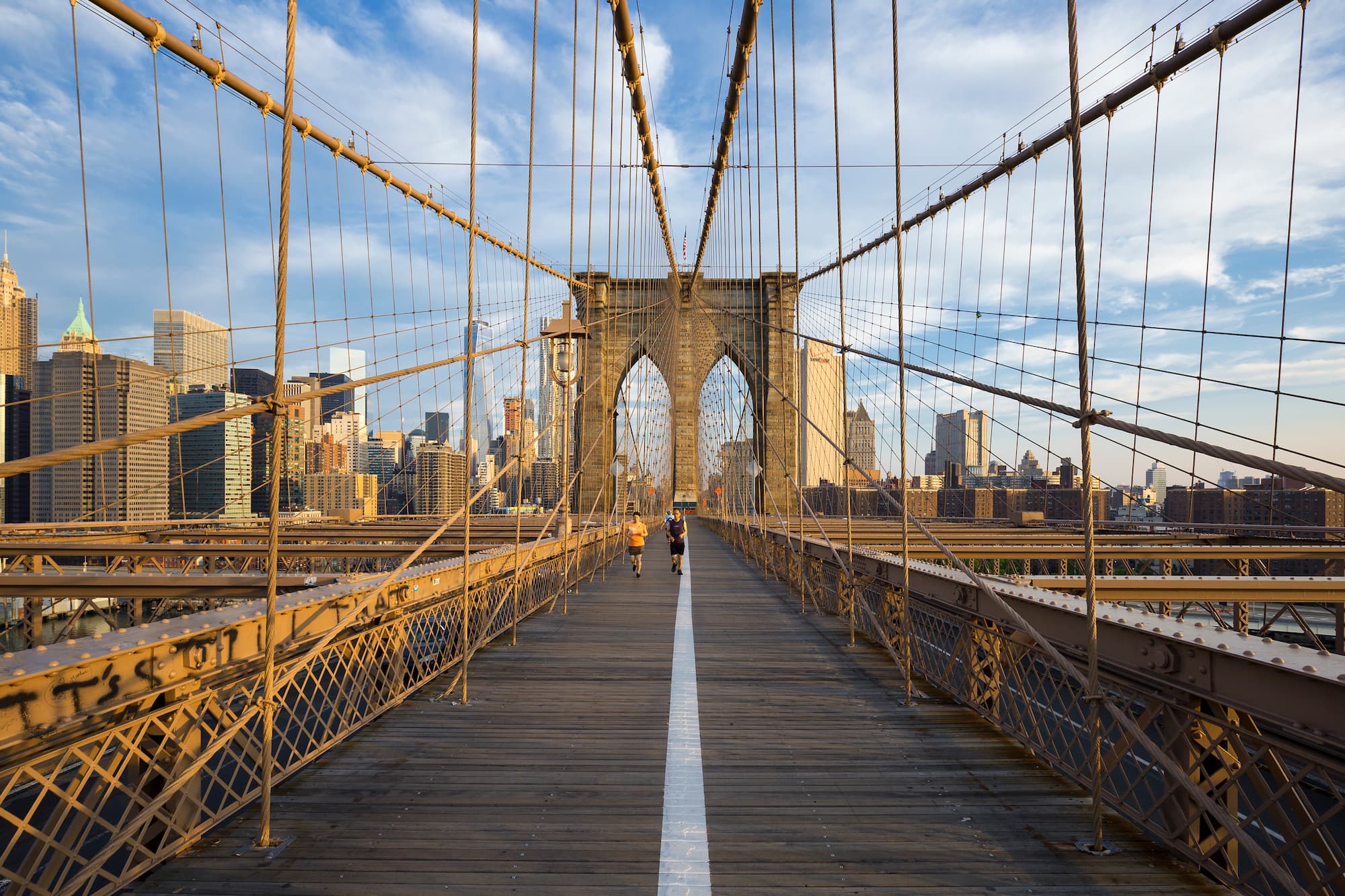 Runners commuting Manhattan Brooklyn bridge New York, USA