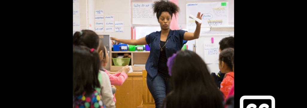 Teacher instructing children